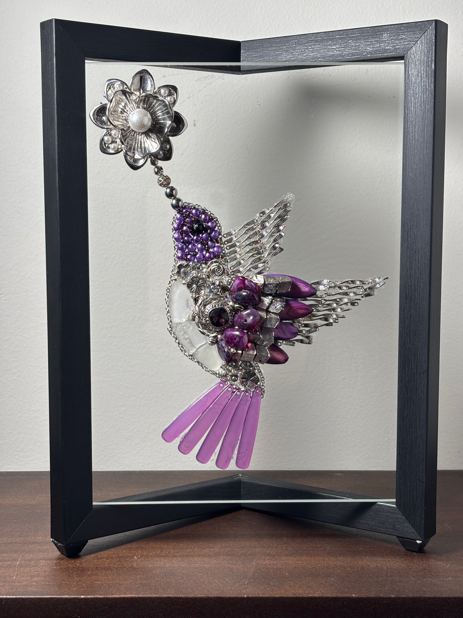 20007 White sea glass humming bird with violet and silver jewelry accents.