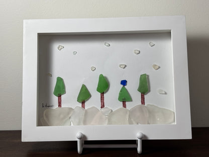 Blue jay in snowy forest made of sea glass